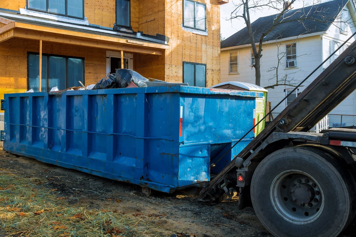 Container loaded with household items collected for hauling