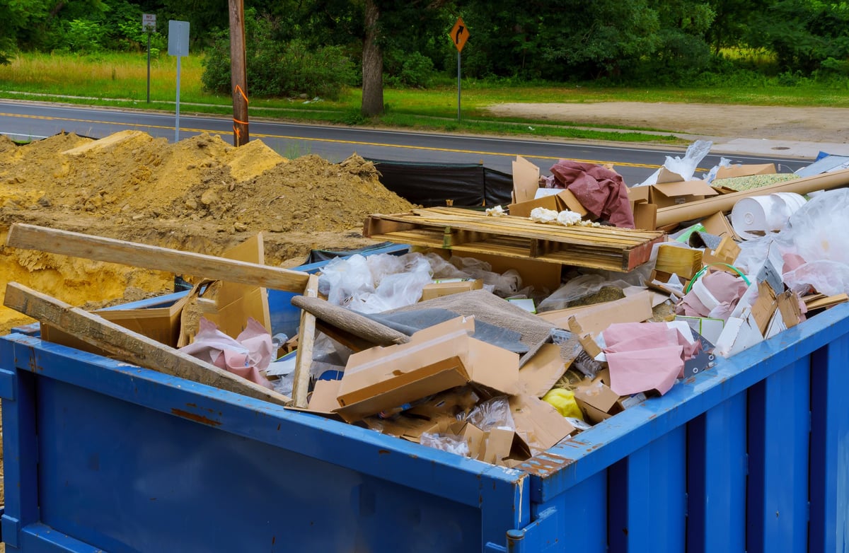 Debris container on a job site after a property cleanup